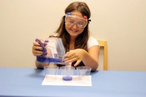 Pouring cabbage juice into cups